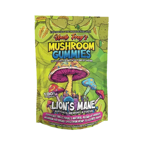 The image is of a product packaging for "Uncle Frog's MUSHROOM GUMMIES" which are described as being infused with "Earth's finest hemp." The packaging is vibrant with a green background and features colorful, stylized mushroom illustrations, including a prominent pink one. It highlights "LION'S MANE" which is noted to support "memory & focus." Additional text indicates the product offers an "experience" with "Uncle Frog's natural blend of cordyceps mushroom and broad spectrum hemp to elevate your day." The packaging also mentions that it contains "Honeydew melon flavoured gummies (1 oz)." The design has a psychedelic flair, with intricate patterns and a playful font choice.
