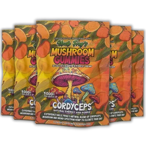 Five packages of "Uncle Frog's Mushroom Gummies" with vibrant, colorful packaging featuring illustrations of mushrooms and a tropical theme. The text highlights "CORDYCEPS," "Natural Energy and Power," and "Experience the Multiverse with Earth's Finest Hemp," suggesting health and vitality benefits. The gummies are mango-flavored and boast a "1000 mg Active PER SERVE" designation, emphasizing their potency.